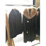 A leather coat (possibly sheep skin) and a fur jacket