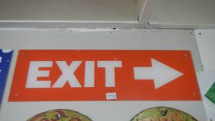 A red exit sign from Pleasure Island.