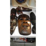 5 carved wood wall masks.