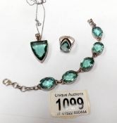 An apatite/silver ring, a bracelet and a pendant.