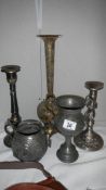 A brass vase, 2 metal candlesticks,, a metal pot and a metal goblet.