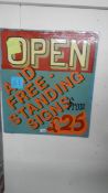 An open and free standing 'Signs from £25' sign.