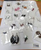 21 pairs of earrings and a pendant.