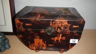 An oriental lacquered casket.