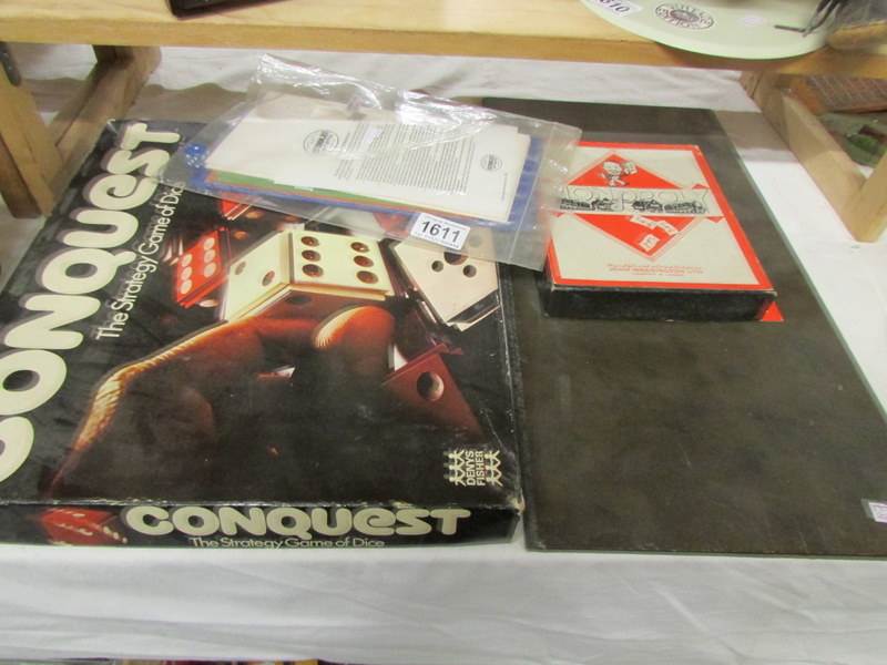 A vintage monopoly set, Ruddles horse shoe game and Conquest Strategy dice game.