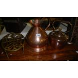 A copper kettle, a copper jug and a brass trivet,