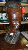 A carved wood African bust.