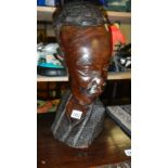 A carved wood African bust.