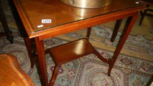 An Edwardian inlaid occasional table.
