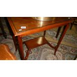 An Edwardian inlaid occasional table.