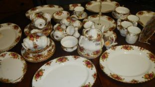 Approximately 60 pieces of Royal Albert Old Country Roses tableware including teapot,