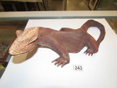 A carved wood Komodo dragon.