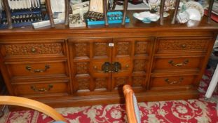 A carved sideboard.