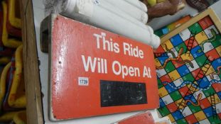 A red 'Ride will open at' sign.