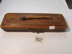 A 19th century glove case (handle a/f) containing a pair of 19th century ivory glove stretches.