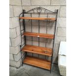 A set of 4 wooden shelves with cast iron frame