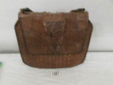 A vintage crocodile skin hand bag.