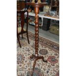 A plant stand on tripod base and with barley twist stem,.