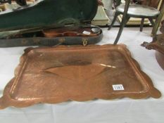 An arts and crafts hammered copper tray.