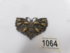 A vintage buckle fashioned as a butterfly in cut steel.