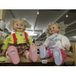 2 cricket dolls in original clothing.