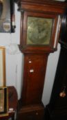 An 8 day grandfather clock with brass face by Edw, Gratrese,