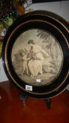 A framed and glazed oval classical scene,.