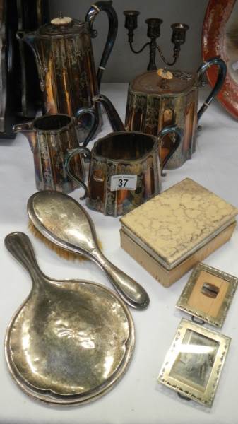 A 4 piece silver plate tea set together with a silver backed brush and mirror.