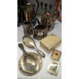 A 4 piece silver plate tea set together with a silver backed brush and mirror.