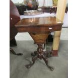 A Victorian work/sewing table with marquetry walnut veneered top.