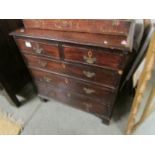 A Georgian walnut 2 over 3 chest of drawers.