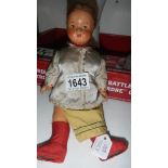 A vintage pot doll in original costume.