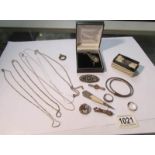 A mixed lot of silver jewellery including brooches, chains, bracelets etc.