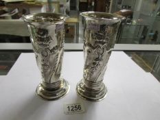 A pair of silver vases with floral decoration, H.M.