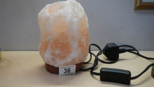 An amber coloured crystal table lamp.
