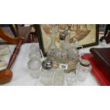 A mismatched glass cruet set and assorted cruet bottles, some a/f.