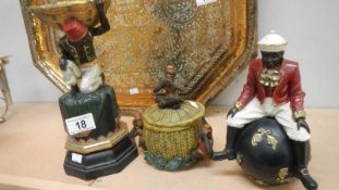 A lidded pot depicting see/hear/speak no evil monkeys and 2 other figures.