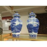 A pair of Adam's blue and white cattle scenery lidded vases, a/f.