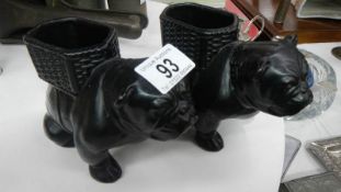 A pair of bull dog posy vases.