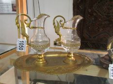A glass and gilt oil on vinegar set on tray.