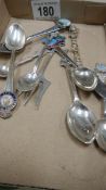 A quantity of souvenir spoons.