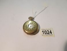 An Edwardian half hunter pocket watch, in working order.