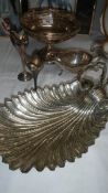 A silver plated shell shaped dish and other silver plate items.