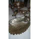 A silver plated shell shaped dish and other silver plate items.