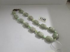 A green bead necklace.