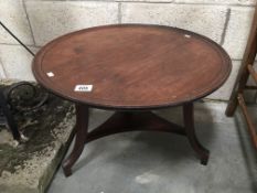 An Edwardian circular coffee table