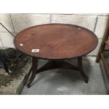 An Edwardian circular coffee table