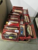 28 Models of yesteryear model cars in burgundy boxes.
