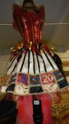 A Casino showgirl dress on stand