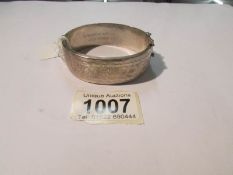 A large hall marked silver bangle.